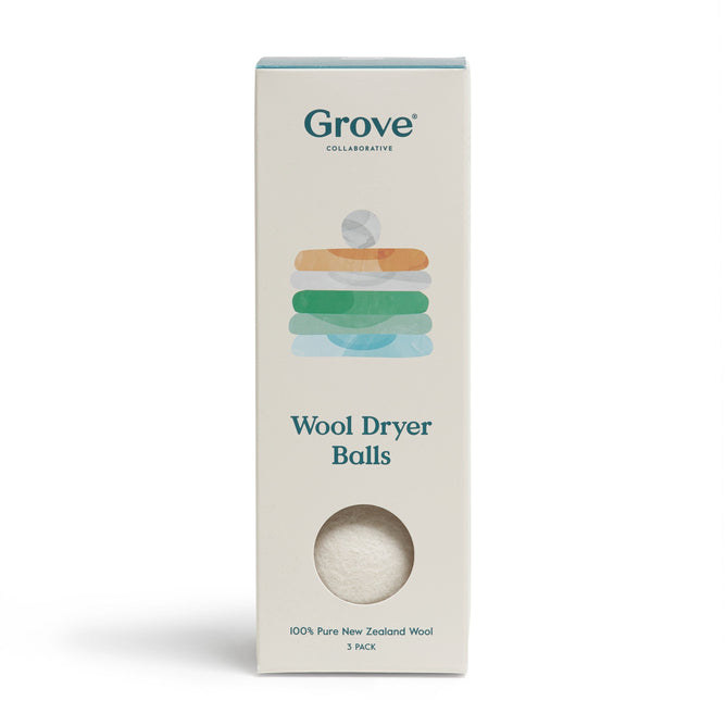 Grove Co. Wool Dryer Balls come in eco-friendly packaging, adorned with a towels illustration, emphasizing 100% Pure New Zealand Wool. A cut-out showcases one hypoallergenic ball.