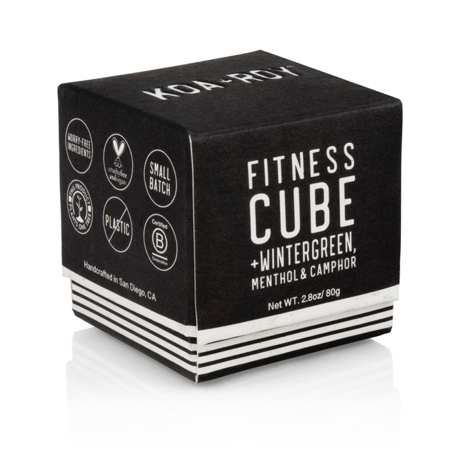 The KOA + ROY Fitness Cube comes in a black cube-shaped package and contains wintergreen, menthol, and camphor for muscle recovery. It features Weight-Free Ingredients, is Small Batch, Plastic Free, Vegan, with a net weight of 2.8oz/80g, made in San Diego, CA using plant-based ingredients.
