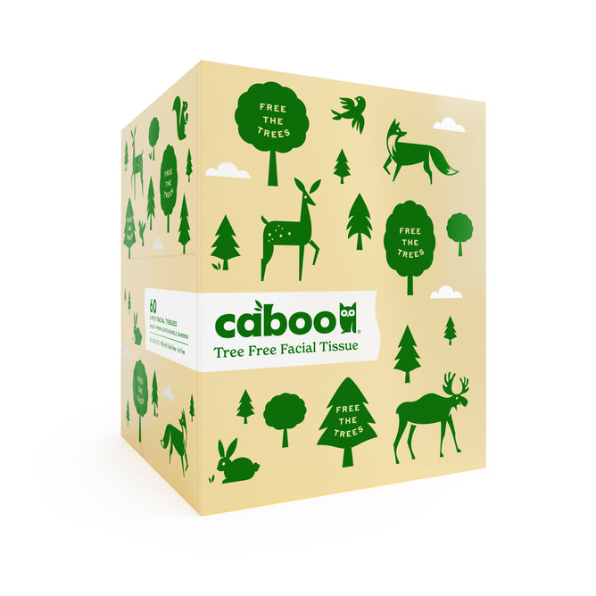 A box of Caboo facial tissue showcases green illustrations of trees and animals, including deer and wolves, with the phrase Free the Trees on a beige background.