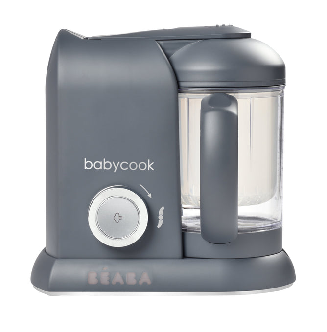 The gray BEABA Babycook Solo Baby Food Maker, with a clear blending container on the right and a round control knob, features steam cooking. The babycook brand name is prominently displayed on the front, making it perfect for easily preparing homemade baby food.