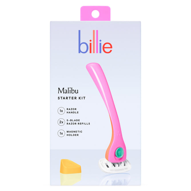 The billie Women’s Razor Kit box, set against a white background with a hanging tag, features a vibrant pink razor known for its ergonomic handle providing an ultra-smooth shave. The kit includes 1 razor handle, 2 five-blade refills, and a magnetic holder.