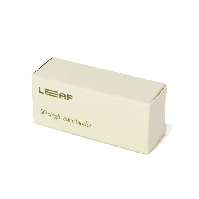 A beige rectangular box labeled Leaf Shave contains 50 single-edge stainless steel Blade Refills against a pristine white background, offering an eco-friendly, plastic-free shaving experience.