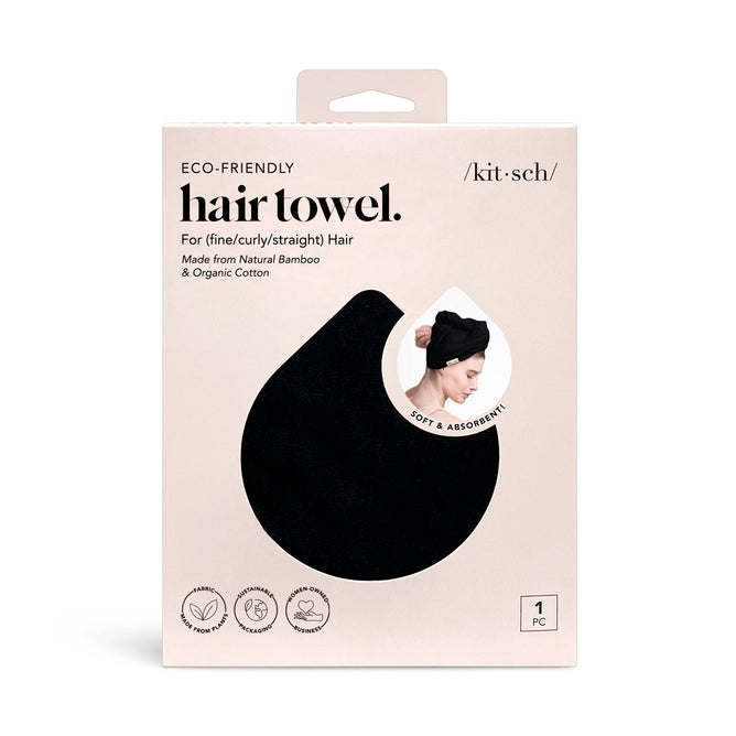 Kitschs Eco-Friendly Hair Towel comes in brown packaging, showcasing a person wearing the black towel. Made from bamboo and organic cotton, its soft, absorbent, and suitable for all hair types.